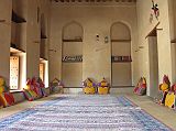 Muscat 06 Nizwa 11 Fort Typical Room With Cushions The Nizwa Fort is huge with a jumble of corridors and staircases. Several of the rooms have been restored, including this one with colourful cushions to sit on the floor.